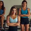 Diverse team of personal trainers in consultation.