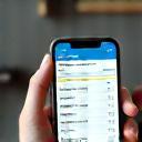 Fitness schedule and booking calendar on mobile phone.